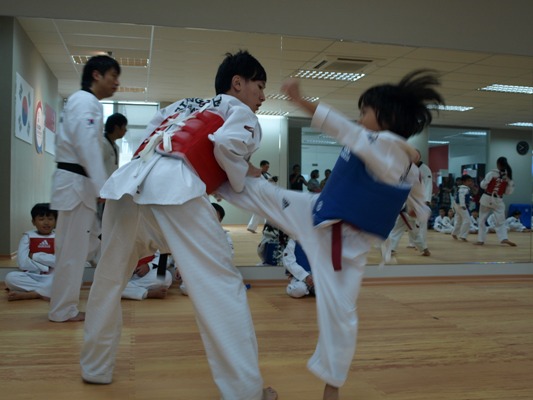 Induk Trainees Spar With the Young Olympians